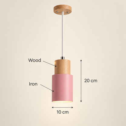 A pendant light with a pink cylindrical shade and a natural wood top, shown with dimension labels indicating 10 cm width and 20 cm height on a plain beige background.