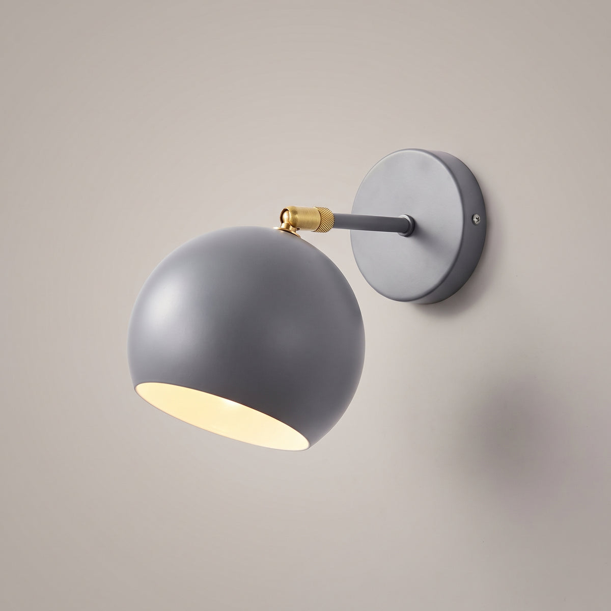 Grey colour option: adjustable ball wall lamp with matt warm grey shade, arm and round wall plate