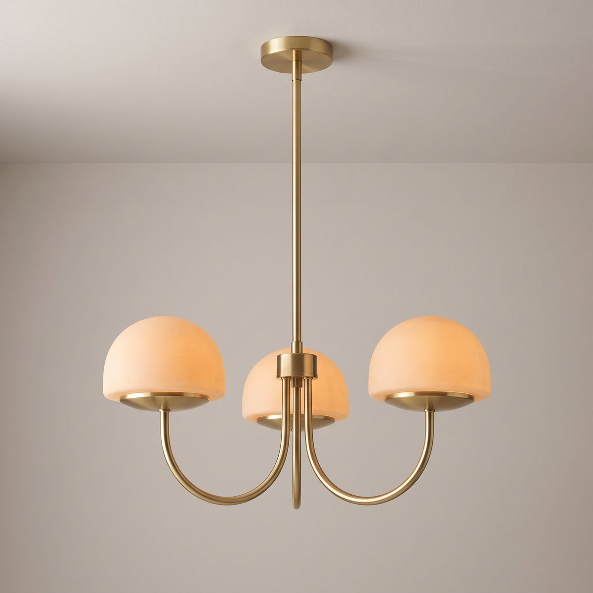 Light Orange, 3 Domes option: Bauhaus glass chandelier with three light orange glass domes on brushed brass arms