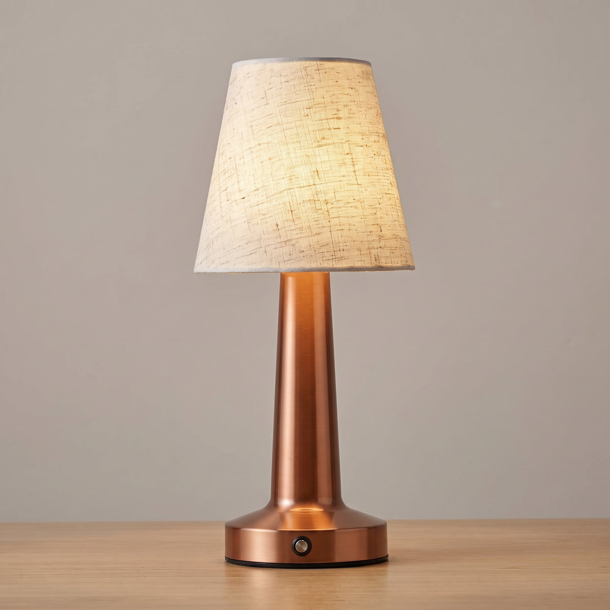 Rose Gold finish option: cordless linen table lamp with a warm copper column and base