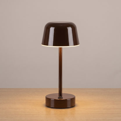 Brown colour option: cordless mushroom table lamp in glossy chocolate brown on a light oak surface