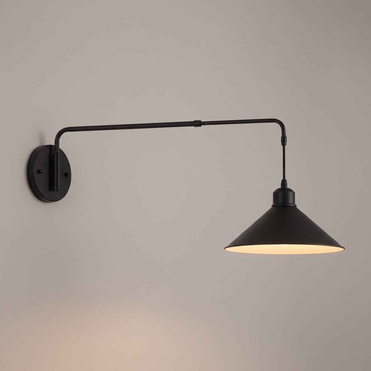Cone shade option: swing arm wall light with a 10 inch matt black cone shade and warm painted interior