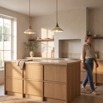 Pair of fluted ceramic pendants above a light oak kitchen island