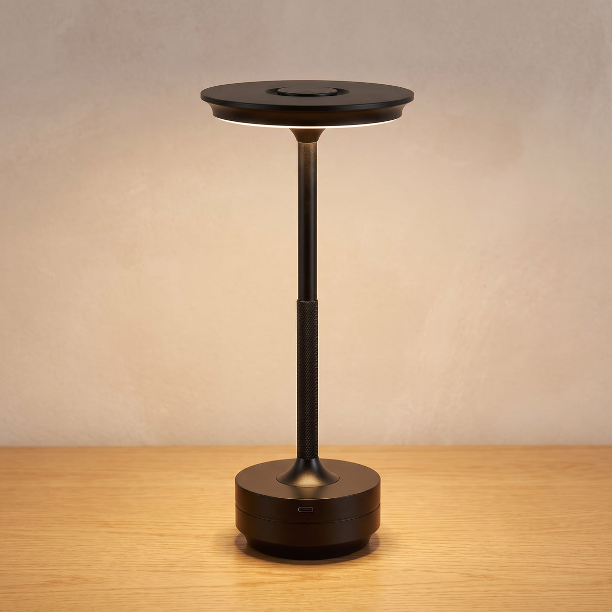 Black finish option: matte black cordless table lamp switched on