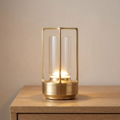 Gold finish option: cordless lantern table lamp switched on