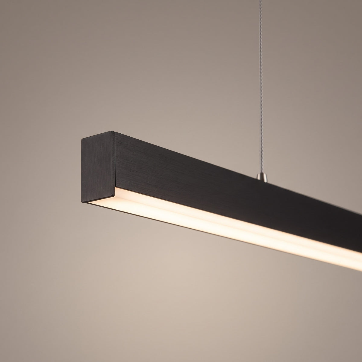 Close up of the slim aluminium bar, frosted diffuser and steel suspension wire
