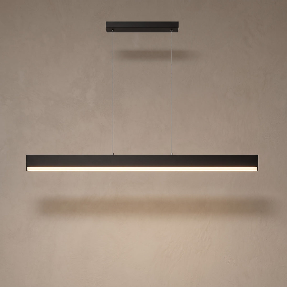 Matte black finish: slim linear LED pendant switched on