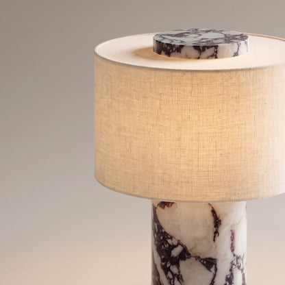 Close up of the viola marble base, linen shade and marble top disc of the table lamp