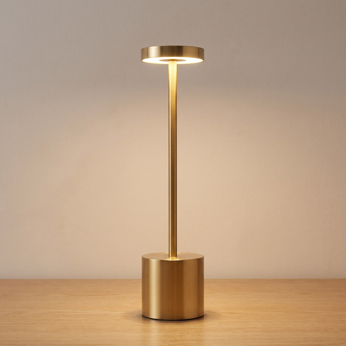 Gold finish option: brushed gold slim cordless table lamp switched on